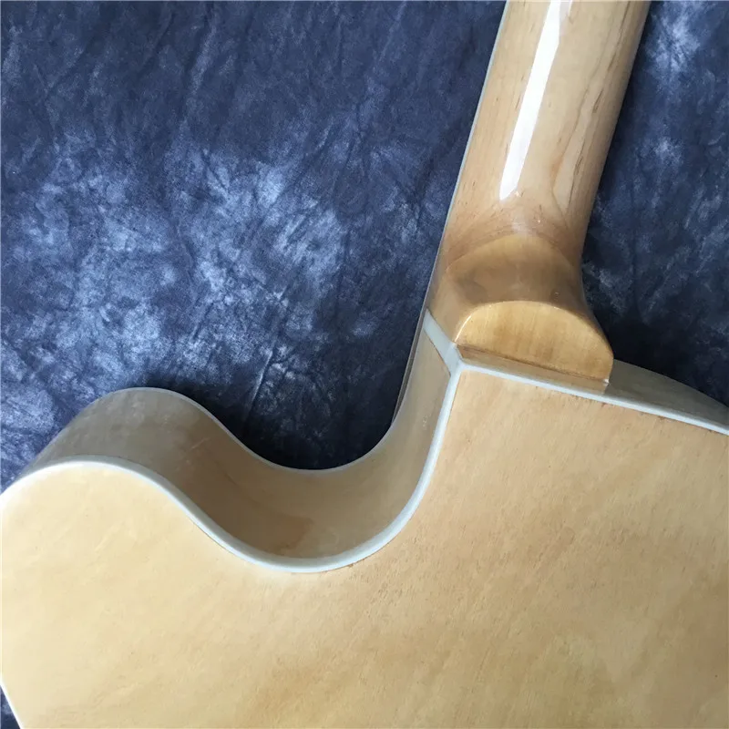 

High-quality six-string jazz semi-hollow electric guitar. Rosewood fingerboard and color shell inlaid guitar, natural wood color