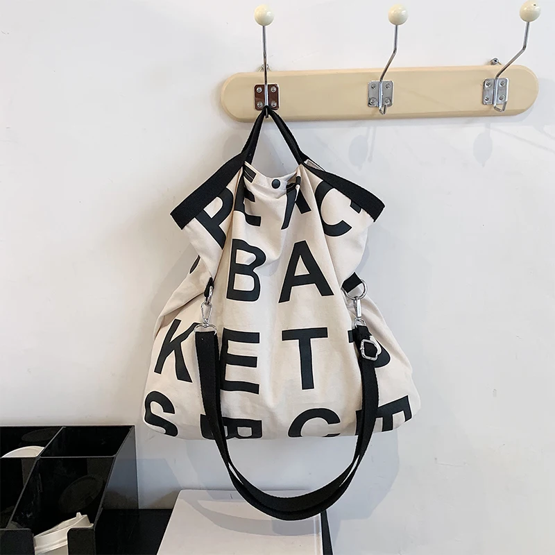 

Canvas bag large capacity women's summer 2021 new fashion niche bag shopping bag hand bill shoulder tote bag