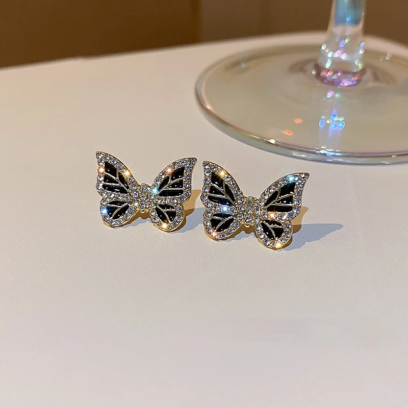 

Origin Summer Simple Shiny Rhinestones Small Butterfly Stud Earrings for Women Black Colour Metal Earrings Delicate Accessories