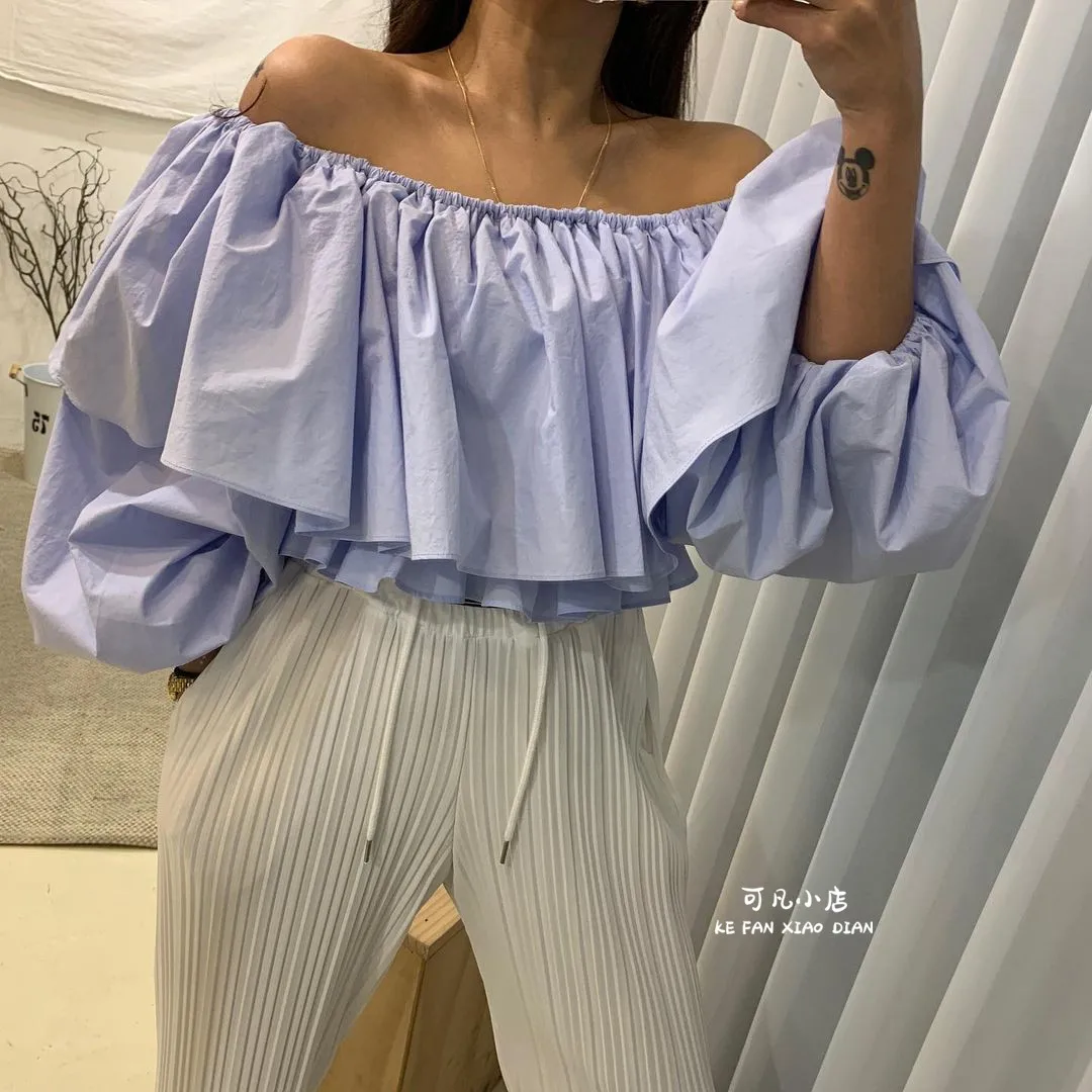 

Korean one-line collar off-shoulder ruffled shirt women's spring and western style cascading loose short baby shirt long sleeves
