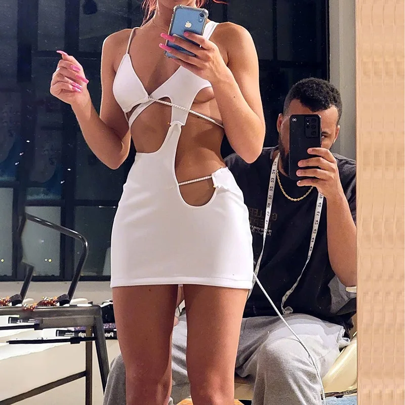 

CIBBAR Sexy Hollow Out White Mini Dress Women V Neck Sleevless Solid Irregular Bodycon Dresses Hipster Midnight Clubwear Skirts
