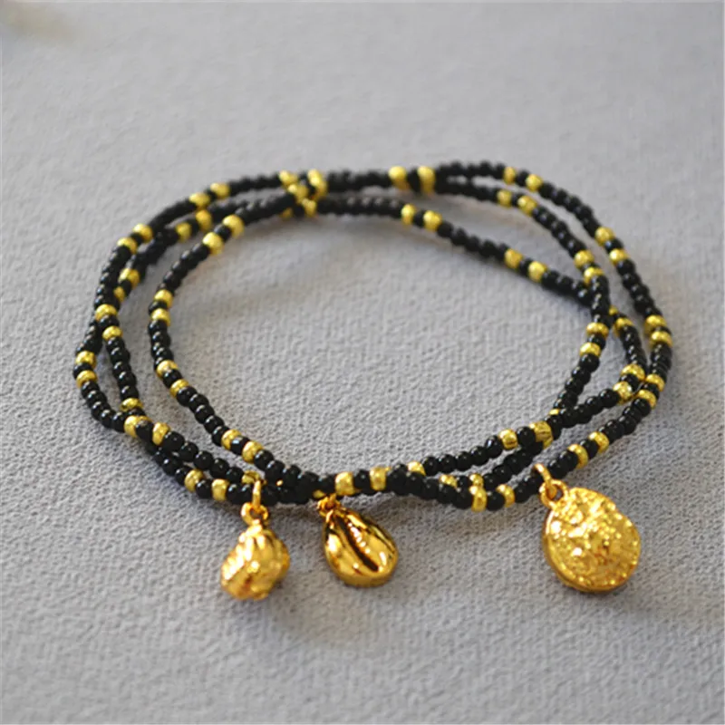 

WT-B576 Buy Fashion Summer fresh sea holiday wind conch pendant black gold white rice bead bracelet wholesale women gift