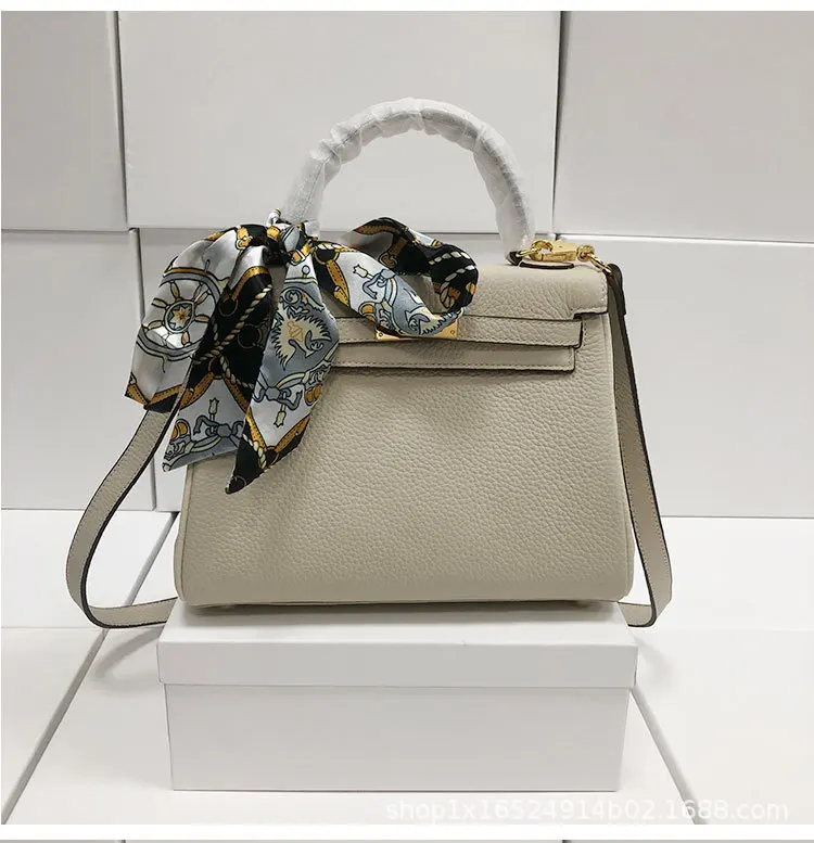 

Manufacturer's spot direct selling top layer cow leather litchi pattern 25cm portable one shoulder cross carrying large