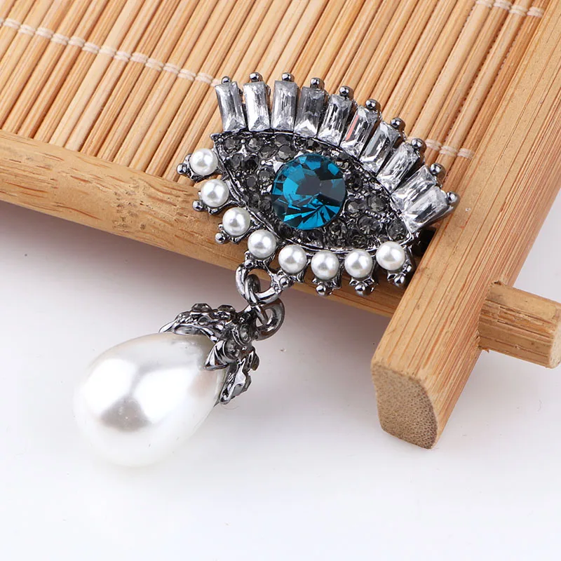 Женская брошка TODOX из сплава золота и цинка с кристаллами в виде птиц-пауков |