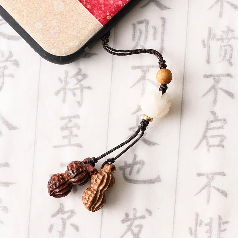 

Peach wood carving wealthy peanut phone chain blood sandalwood boxwood ebony mobile phone pendant custom phone pendant jewelry