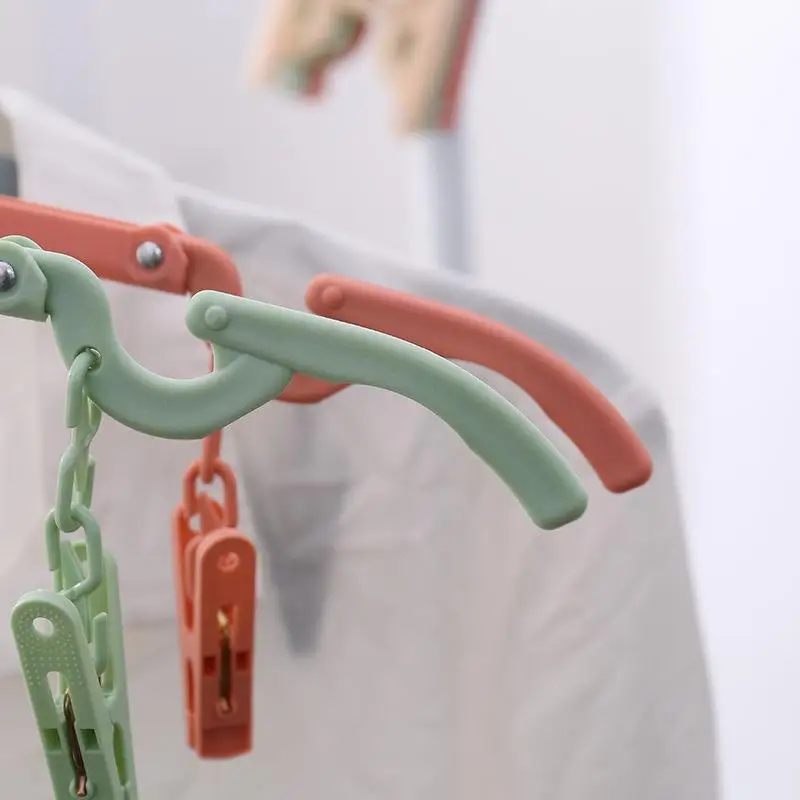 

Non-slip Plastic Clothes Hanger Folding Laundry Storage Hanger with 2 Clips
