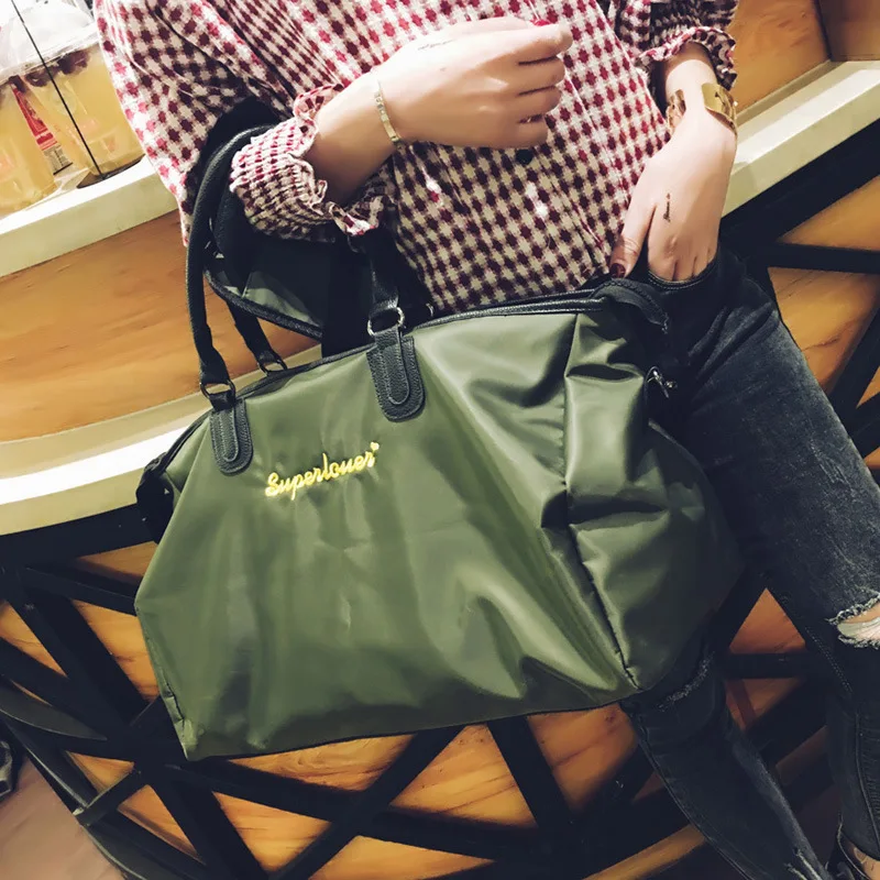 

New short-distance travel mountaineering bag Korean version of large-capacity Oxford cloth handbag fashion simple fitness bag