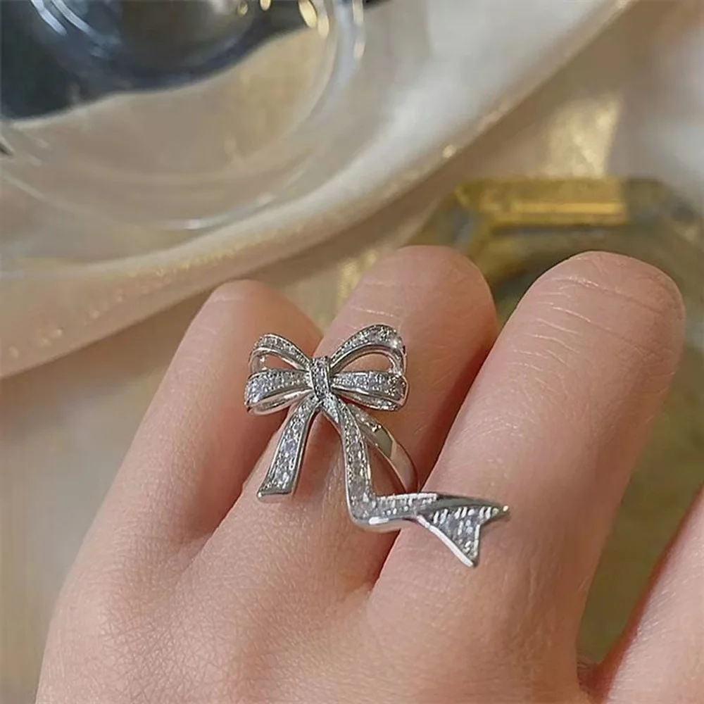 

New European and American fashion ladies party alloy inlaid diamond bow hollow ring design fashion trend opening adjustable ring
