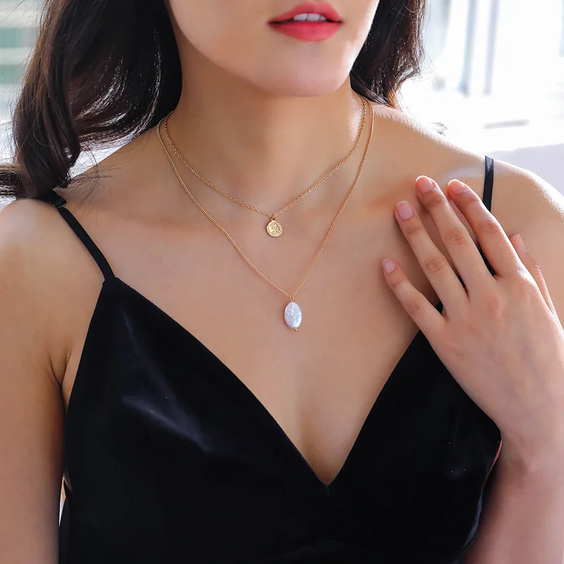 Двухслойная оболочка и жемчужное ожерелье с подвеской из натурального золота