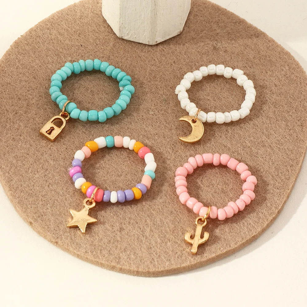 

4Pcs/set Colorful Rice Bead Rings for Women Fashion Star Moon Pendant Ring Set Adjustable Handmade Finger Ring Girls Jewelry Set