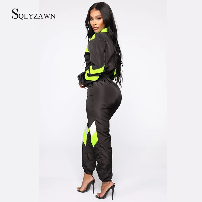 Женский спортивный комбинезон на молнии с длинным рукавом и цветными блоками