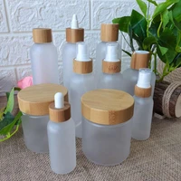 100pcs custom packaging plastic pet empty cosmetic spray bottle cream jar with bamboo lid shampoo skin care lotion packaging jar