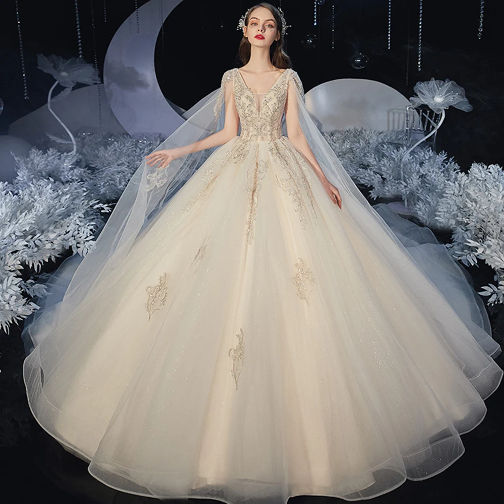 

Dioflyusa Luxury Lace Crystal Fairy Bride Train Wedding Dress 2021 Champagne V-neck Cape Elegant Simple Formal Tulle Ball Gown