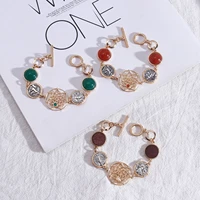 round gold border frame red semi precious stone geometry cutout hollow flower ot buckle bracelet for women courtly style jewelry