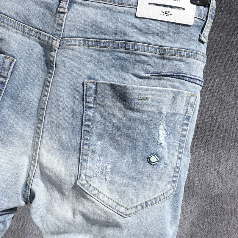Korean Style Men Jeans Retro Light Blue Elastic Slim Ripped Jeans Men Street Fashion Patched Designer Casual Denim Pencil Pants
