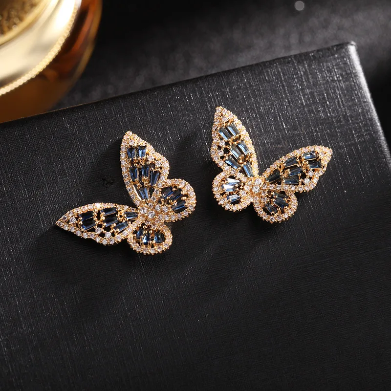 

Korea hollow butterfly earrings silver pin cubic zirconia insect stud earrings women luxury wedding jewelry brand earring