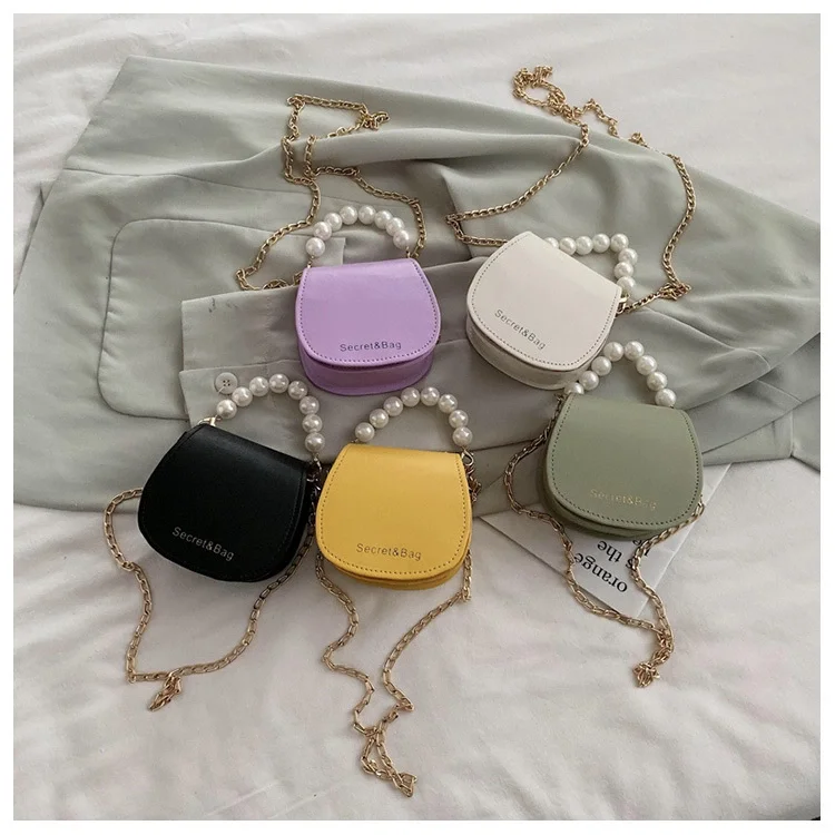 

Chic little bag new female 2020 han edition of the bill of lading shoulder chain pearl hand bag fashionable joker his saddle bag