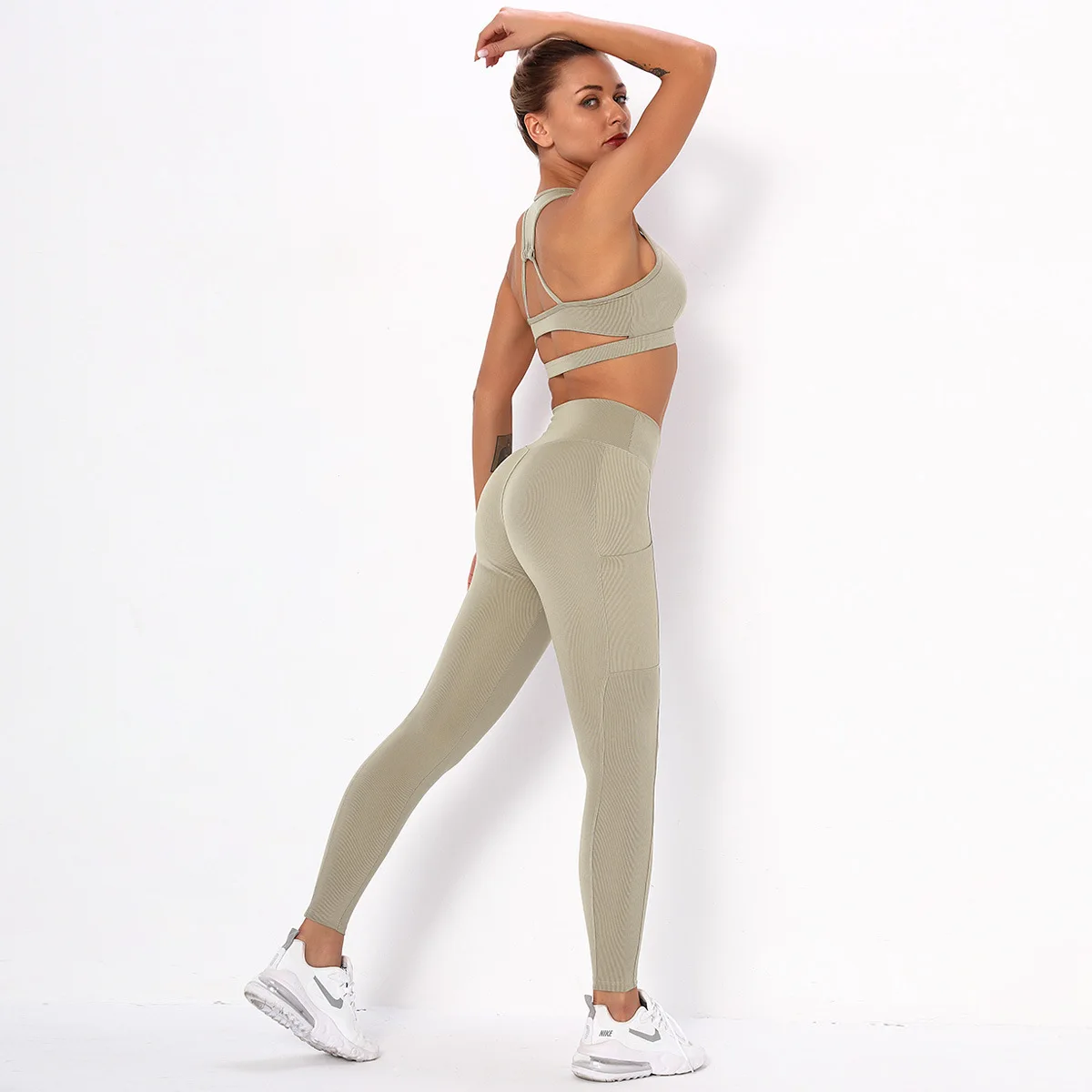 

Hot selling slim striped pocket yoga suit women's beauty back top bra sports running fitness yoga pants