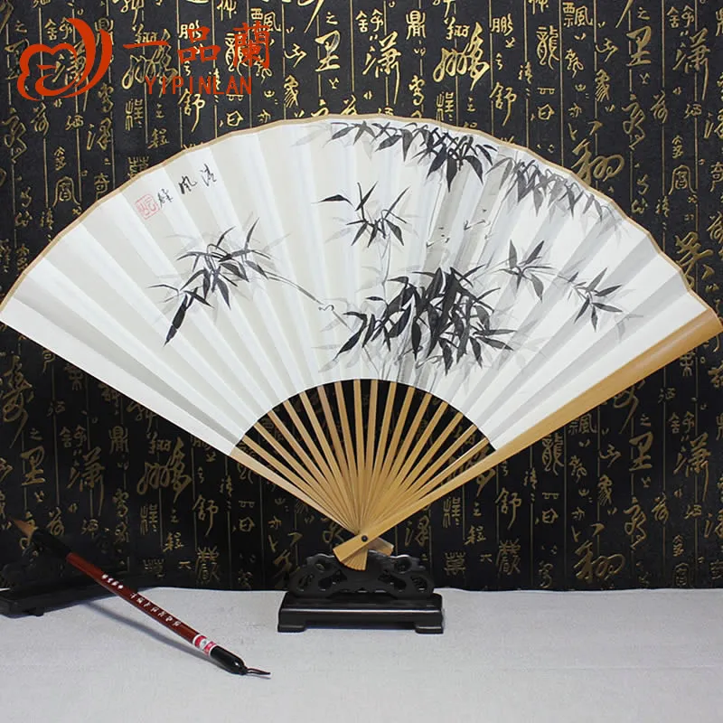 

|A hand-painted white paper fan of Magnolia, jade and bamboo