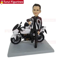 man wear jumpsuit and his motorbike figurines sculptures dolls statuette motorcycle birthday cake stand