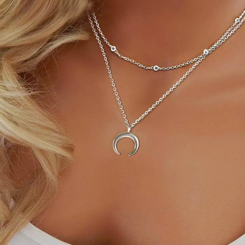 Массивное ожерелье из рога многослойное с длинным полумесяцем и двойным рогом