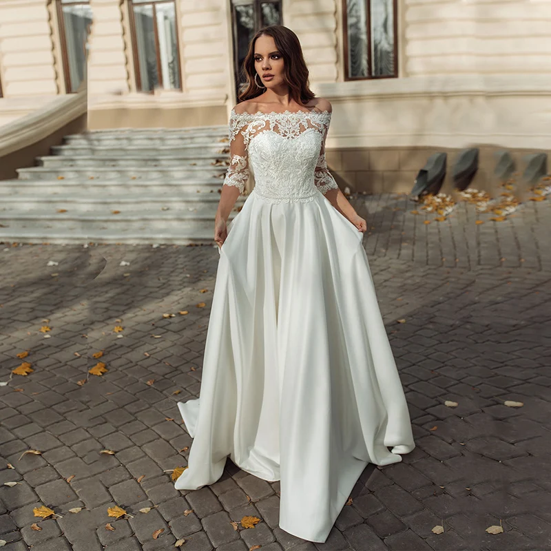 

Hot Sale Modern Lace ivory Bridal Wedding Gowns with Off Shoulder 3/4 Sleeves Bateau Neck Wedding Dresses for Bride Buttons Back