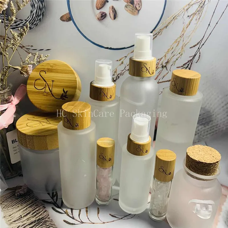 

Eco-friendly wooden lid bamboo cap frosted transparent matte plastic bottles and jars skin care cream jar bulk wholesale