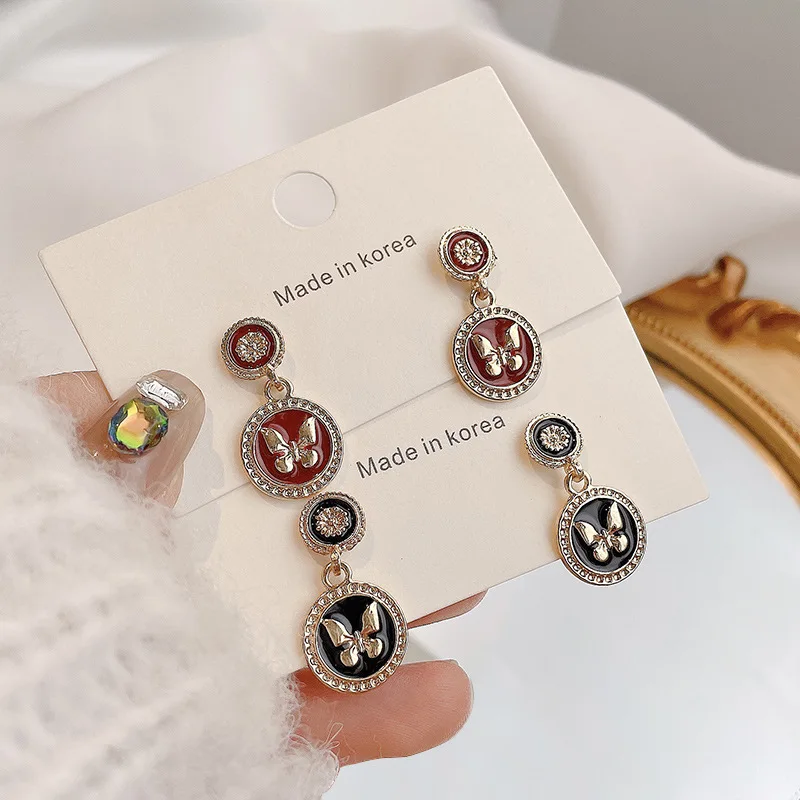 

Europe and America restore ancient ways metal butterfly eardrop 925 silver needle cold wind earrings