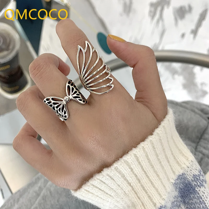 

QMCOCO Silver Color Party Rings New Fashion Creative Hollow Out Butterfly Wings Wide Rings Wedding Bride Jewelry Gifts For Women