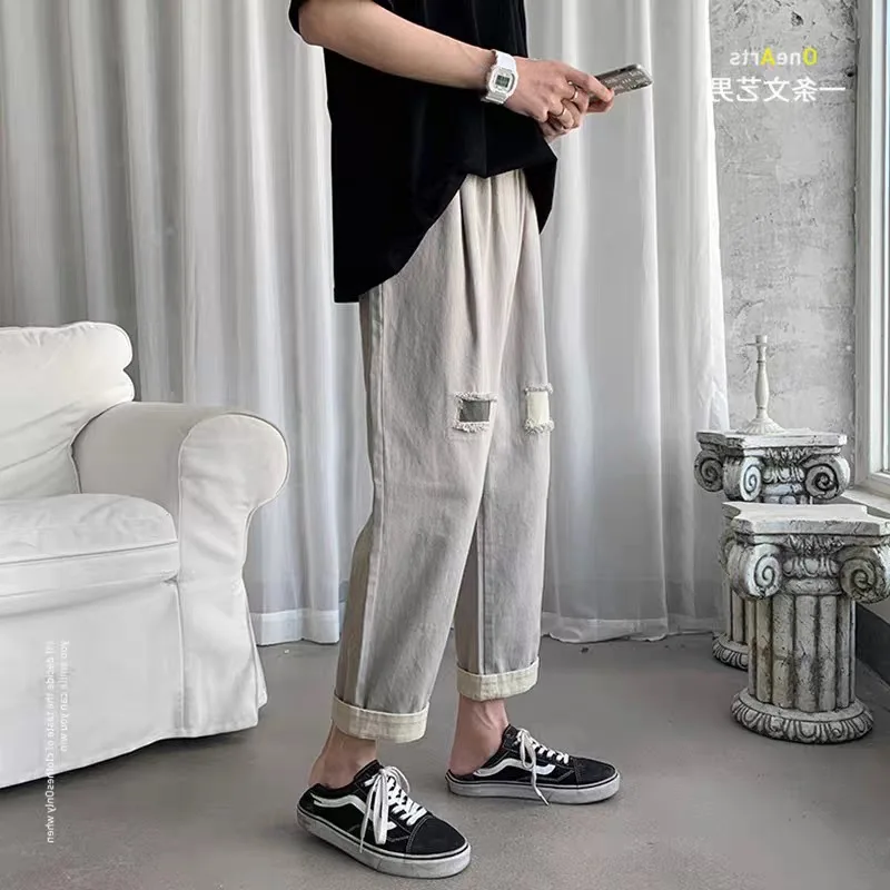 

Denim Pants men's Korean brand ripped hole trouser 2021 summer loose wild hole casual handsome straight students jeans