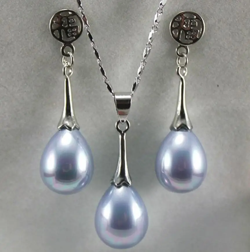 

The lady's Pearl Necklace/Earrings jewelry set is engaged.