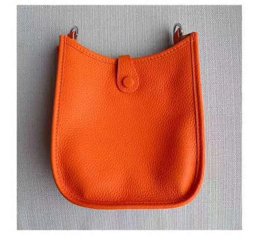 

Evelyn bag h litchi pattern bucket bag 2021 new cowhide wide shoulder belt messenger single room bag hollow women's bag handbag