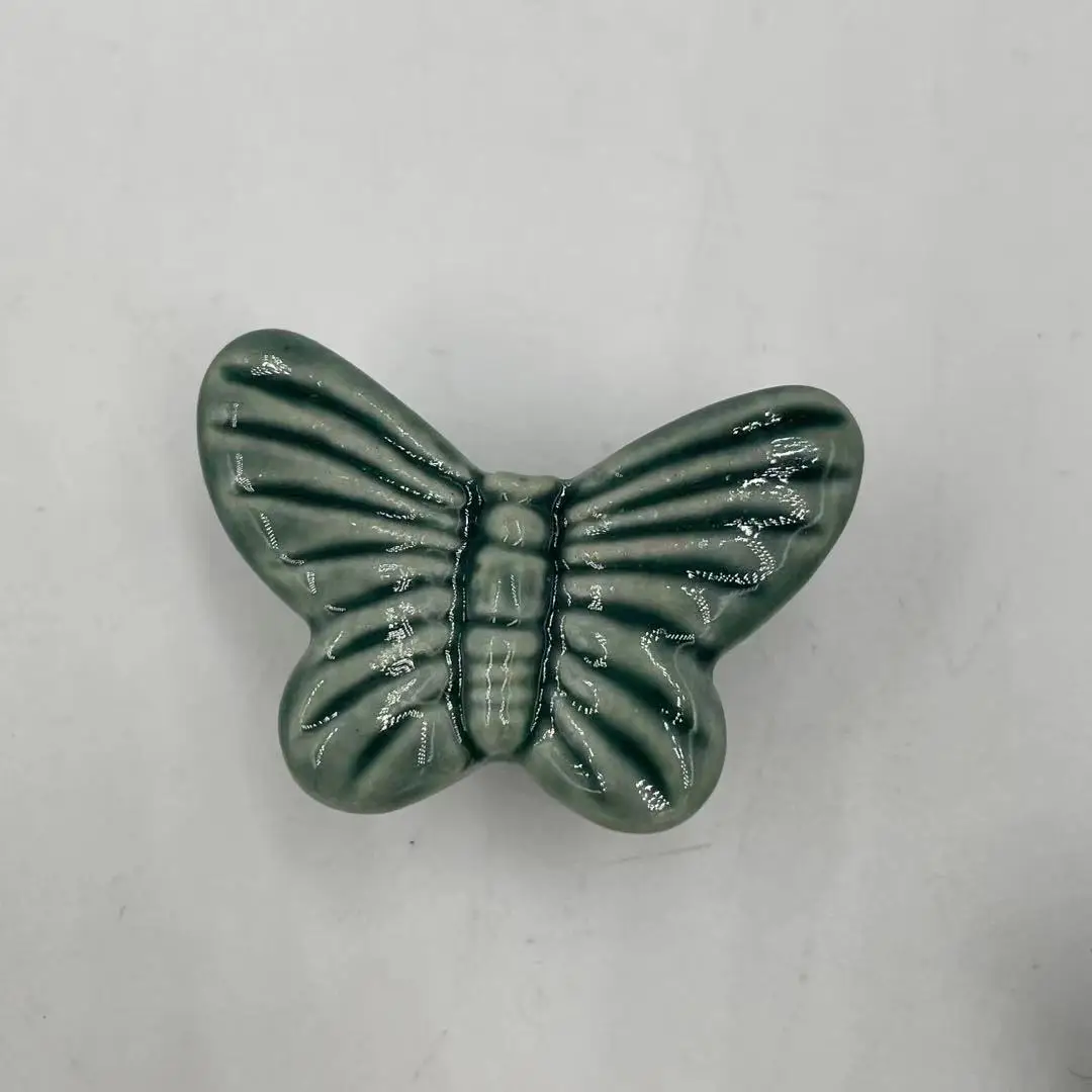 

Керамическая ручка зелёного цвета