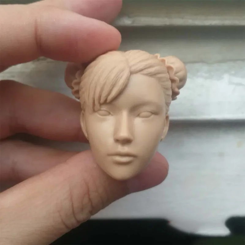 

Unpainted 1/6 Little Girl Chun Li Head Sculpt Carving Model Fit 12 inch Female Action Figure Body for Fans DIY