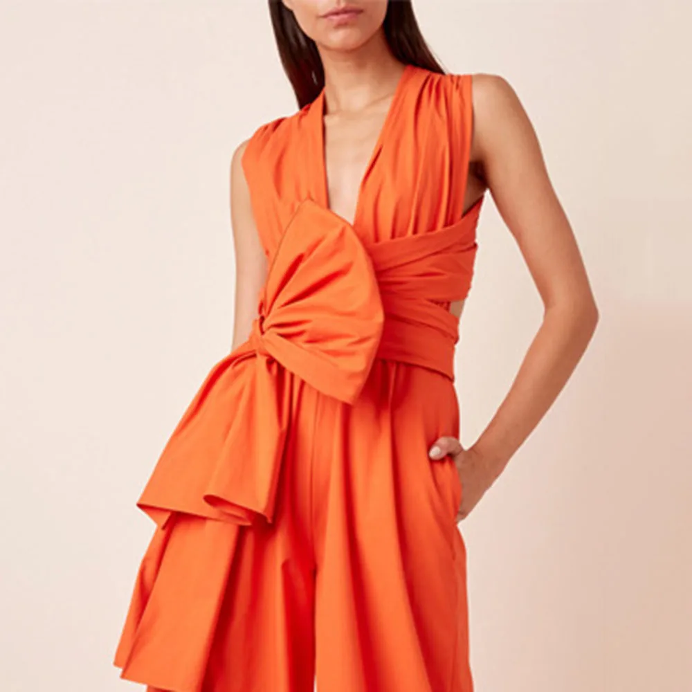 

Europe America New 2021 Summer Loose Fashion Temperament Commute Jumpsuit Solid Color Rosette V-neck Sexy High Waist