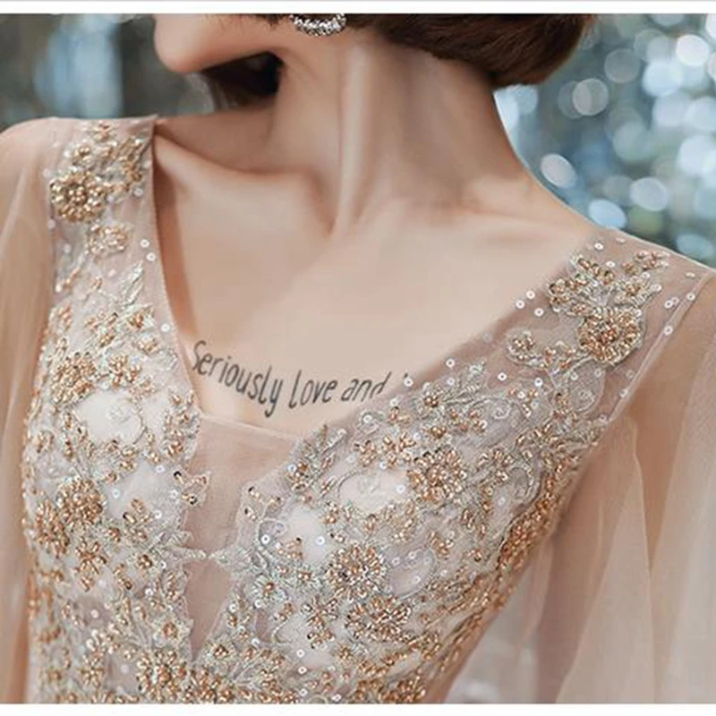 

Champagne evening dress female banquet temperament long super fairy fluttering exquisite sequin fashion cheongsam A line robe