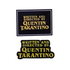 Написано и написано Квентином Тарантино Эмалевым штифтом Inglourious Basterds, резервуар собак, режиссер чтения целлюлозы