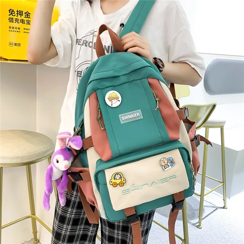 

Новый Модный женский рюкзак 2021, трендовая подвесная школьная сумка для девочек-подростков, вместительные нейлоновые водонепроницаемые дор...