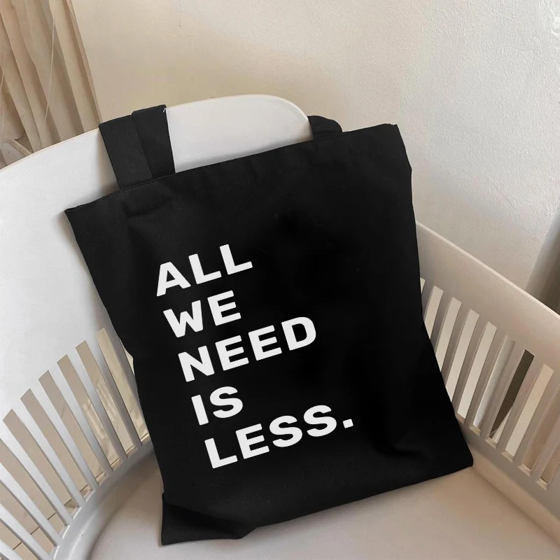 

ALL WE NEED IS LESS Funny Letter Print Shopper bag Women canvas tote bag Black White Graphic shopping bag for girl lady bolsa