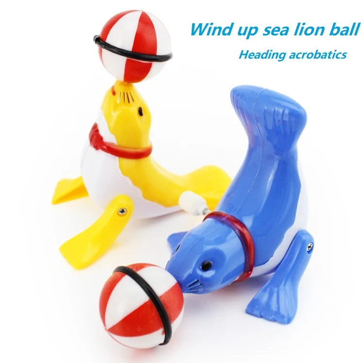 

Wind-up clockwork toy little dolphin little sea lion walking acrobatic top ball 360-degree rotating children's toy gift