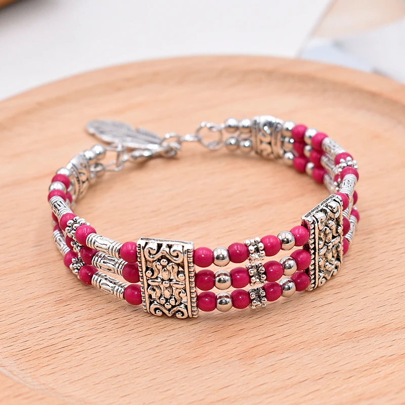 Браслет "Bohemian Vintage" из природных камней с подвеской пера для женщин, национального ручного изготовления, украшенный резными бусинами в стиле бохо.