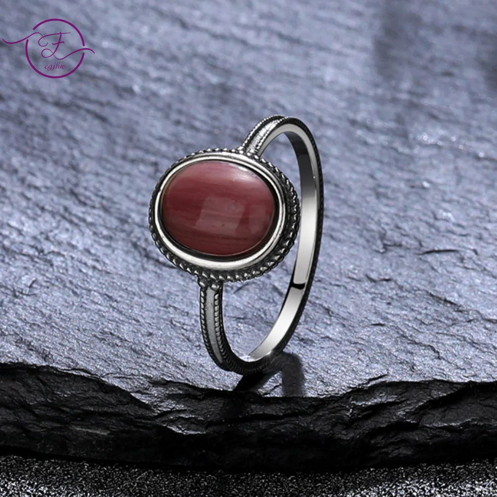 

Женское кольцо из серебра 925 пробы с родохрозитом и натуральным тигровым глазом