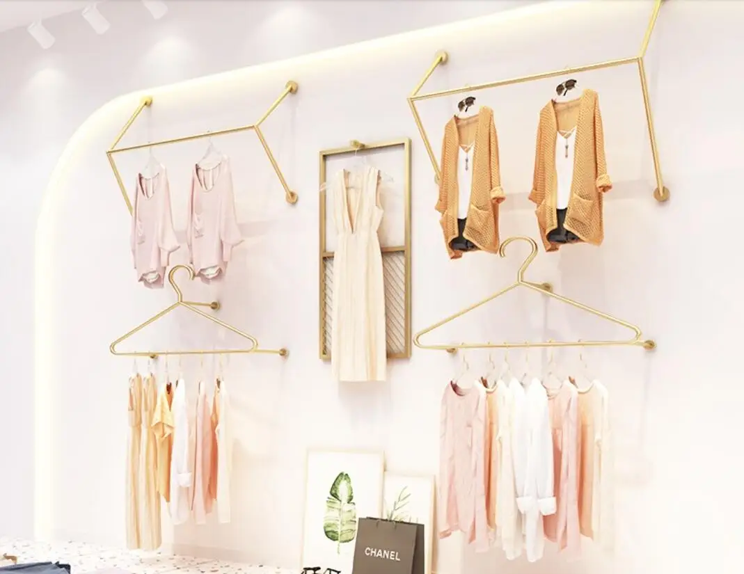 

Clothing display on the wall A rack for hanging clothes on the wall of a women's clothing store Children's clothing shelf