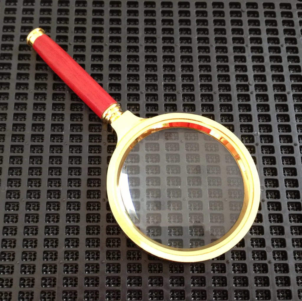 Лупа с золотистой оправой для ювелирных изделий ручная 80 мм 10 кратным