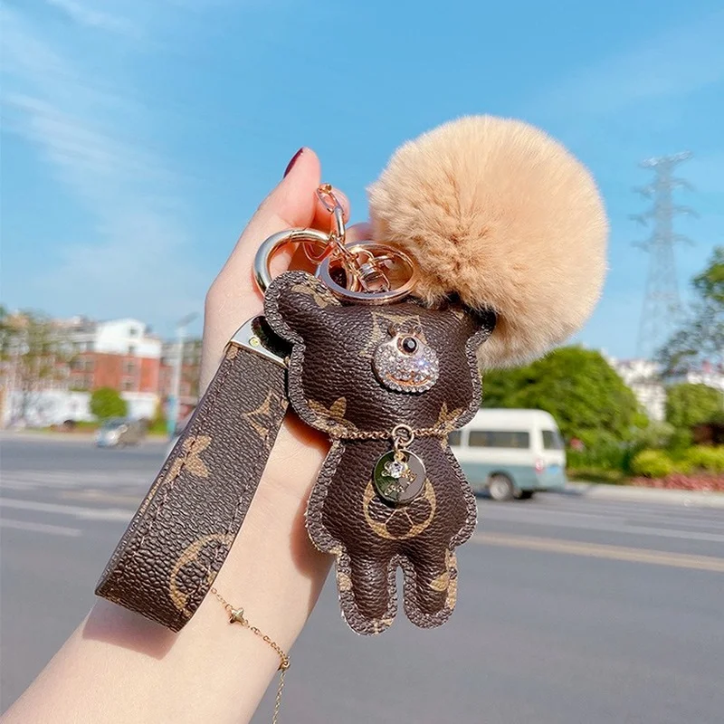 

Luxury Ladies Keychain High Quality Leather Bear Tassel Hair Ball Pendant Trendy Fashion Bear Car Key chain Charm Jewelry Holde