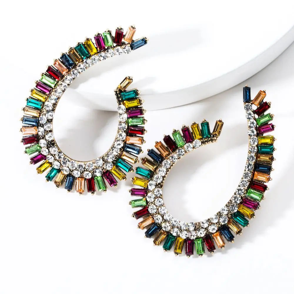 Необычные изысканные серьги-капельки с кристаллами геометрической формы кривой