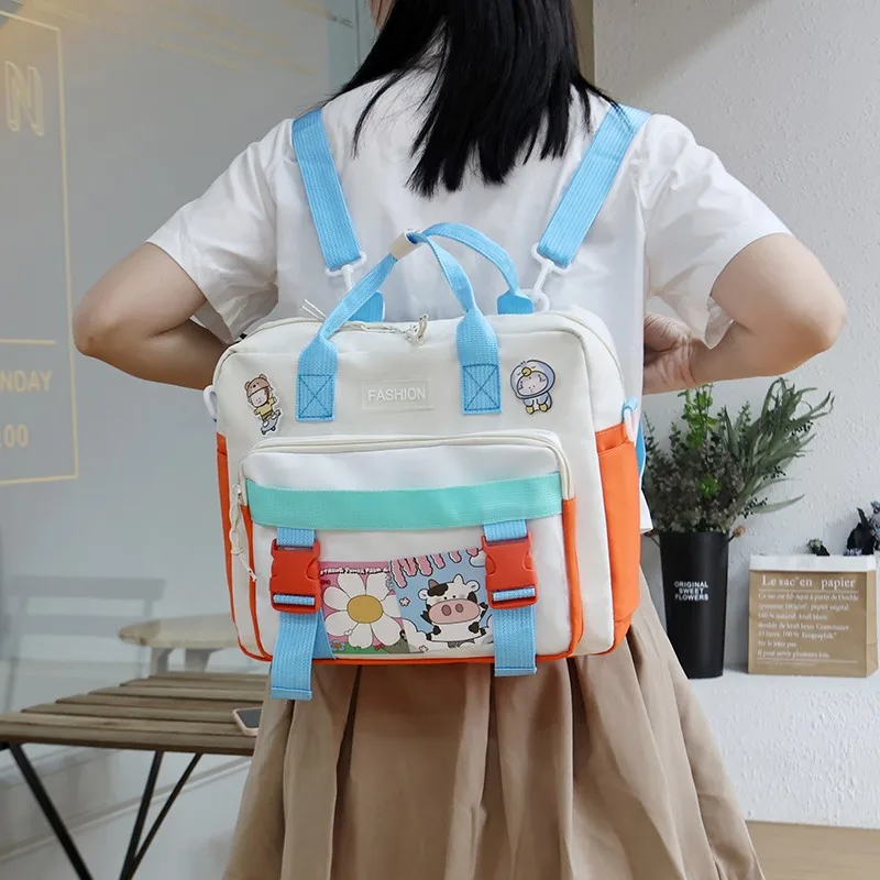 Модный женский рюкзак с милым кулоном, нейлоновая школьная сумка контрастных цветов для девочек, вместительные водонепроницаемые сумки-ме...