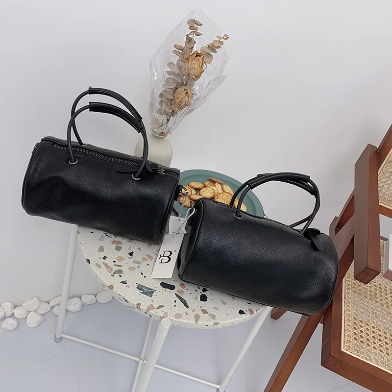 

Soft leather pillow bag new Korean texture hand-held shoulder bag simple cylinder diagonal span women's bag