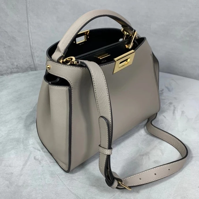 

2020 new retro leather rotating buckle kitty bag commuter portable female bag fashion shoulder messenger small bag trend