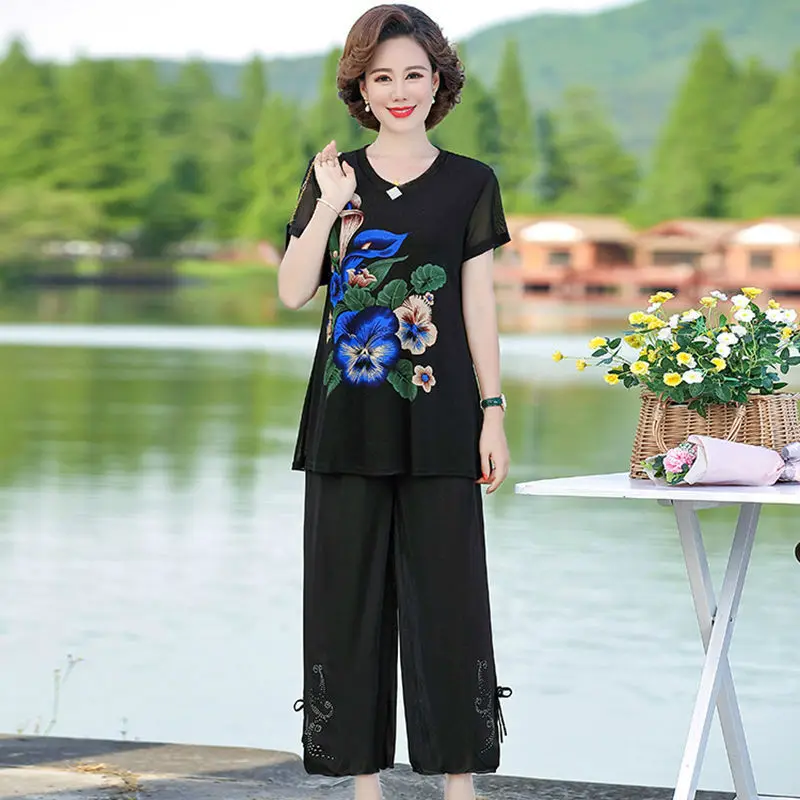 

2021 fashion new loose plus size women's spring and summer suit mesh short-sleeved T-shirt top wide-leg pants two-piece